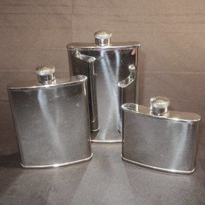 m Trio of Stainless Steel Hip Flasks. New